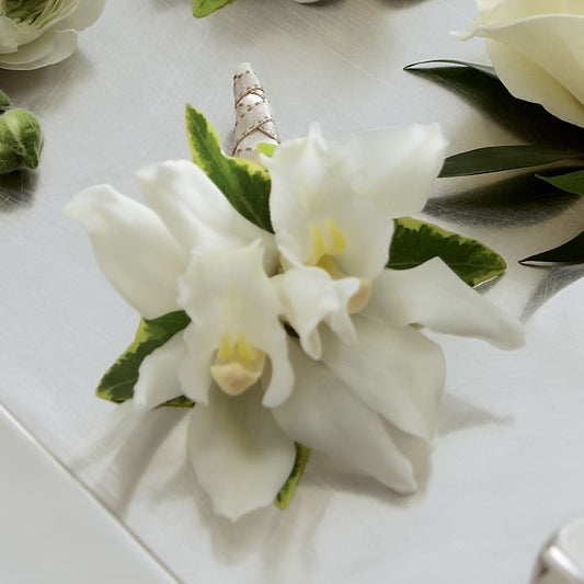 White Mini Cymbidium Boutonniere –  Paola Parra Flowers, Clermont FL